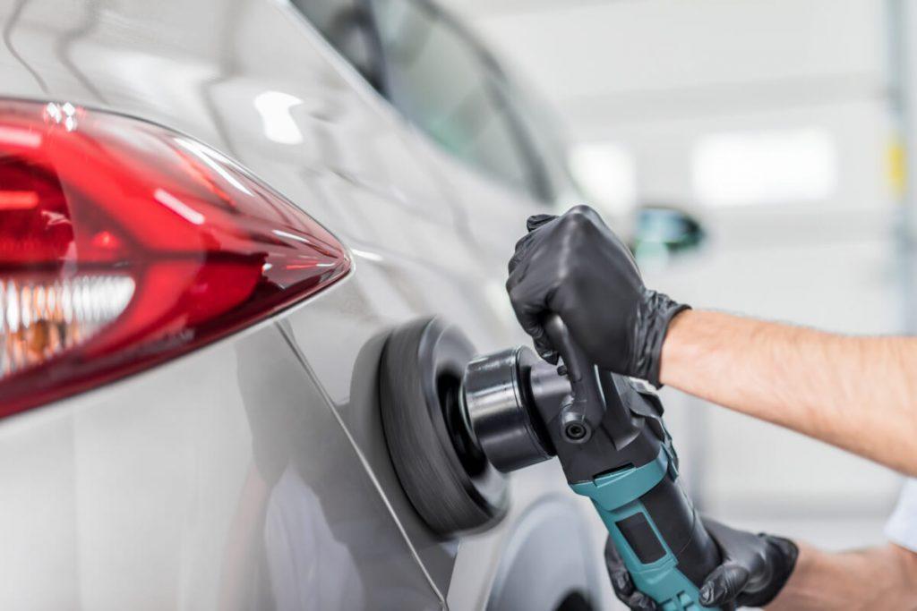 Detailing professional polishing a car