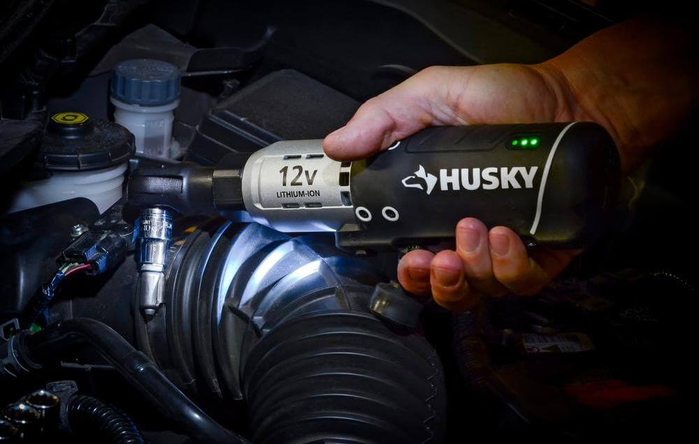 Mechanic using Husky 12-Volt Cordless Ratchet