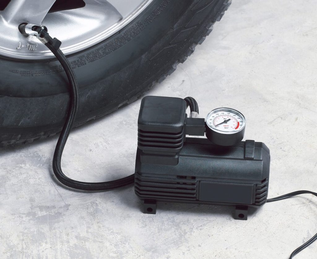 Tire inflator with gauge