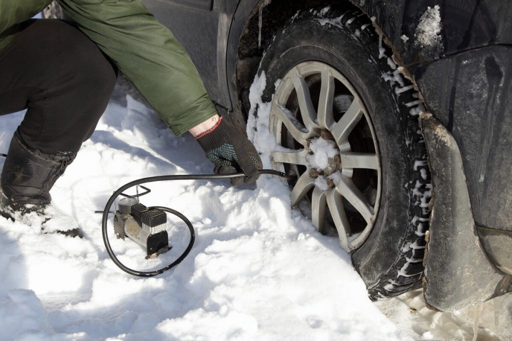 inflating tire in snow