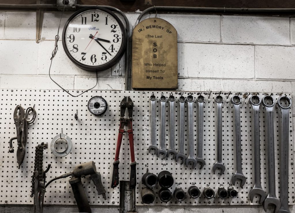 small pegboard and wrenches