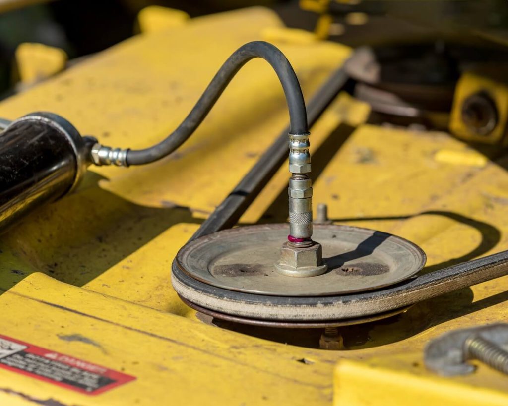 Grease gun on lawnmower